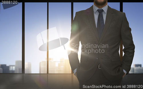 Image of close up of business man over office background