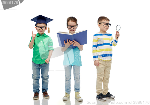 Image of kids in glasses with book, lens and bachelor hat