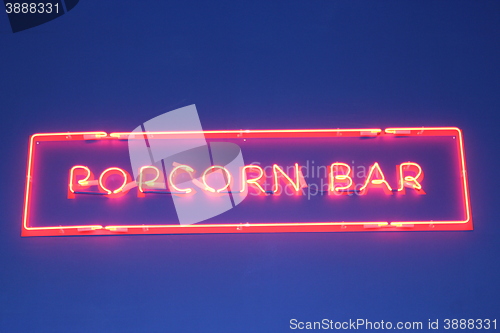 Image of inscription popcorn made from red neon lights