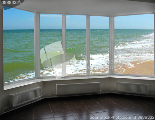 Image of plastic window with view of marine waves