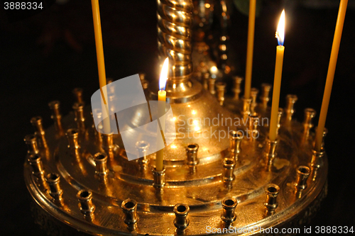 Image of church candles brightly burning 