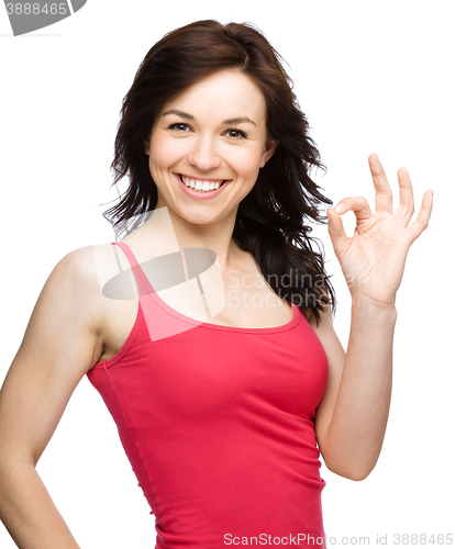 Image of Woman is showing OK sign