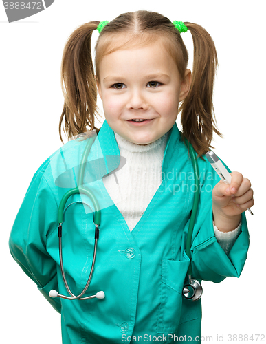 Image of Cute little girl is playing doctor