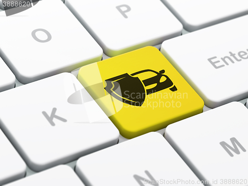 Image of Insurance concept: Car And Shield on computer keyboard background
