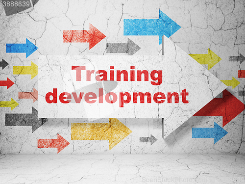 Image of Learning concept: arrow with Training Development on grunge wall background