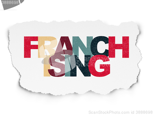 Image of Finance concept: Franchising on Torn Paper background