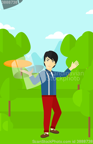 Image of Man playing flying disc.