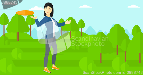 Image of Woman playing flying disc.