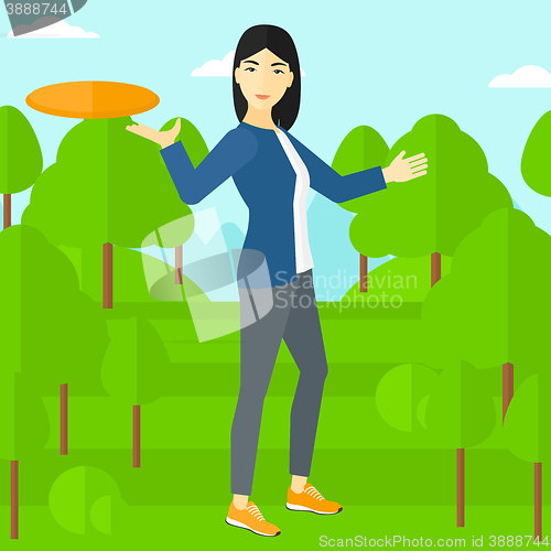 Image of Woman playing flying disc.