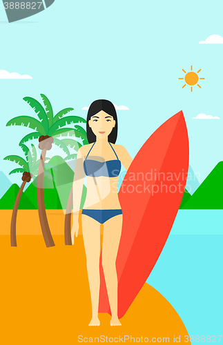 Image of Surfer holding surfboard.