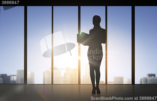 Image of silhouette of business woman with folders