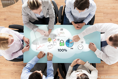 Image of close up of business team sitting at table