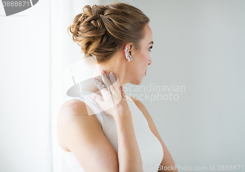 Image of close up of beautiful woman with ring and earring