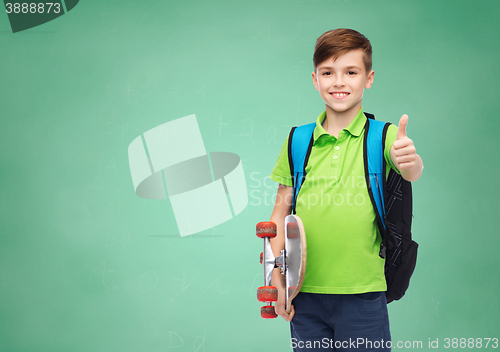 Image of boy with backpack and skateboard showing thumbs up