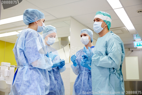 Image of group of surgeons in operating room at hospital