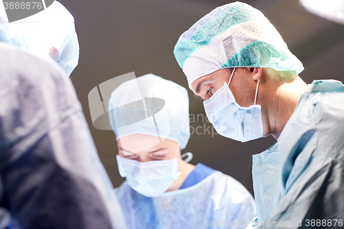 Image of group of surgeons in operating room at hospital