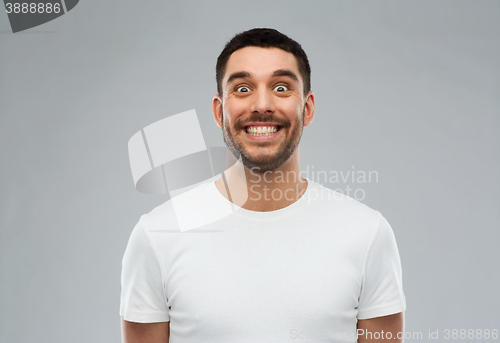 Image of man with funny face over gray background