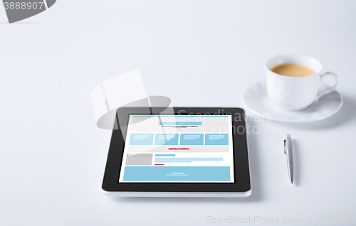 Image of close up of tablet pc with web design template