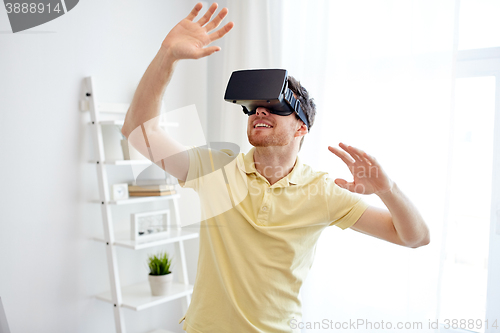 Image of young man in virtual reality headset or 3d glasses