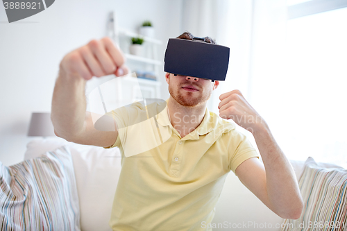 Image of young man in virtual reality headset or 3d glasses