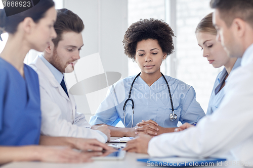 Image of group of happy doctors meeting at hospital office