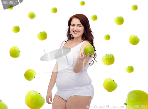 Image of happy plus size woman in underwear with apple
