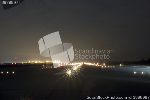 Image of Runway lights at night