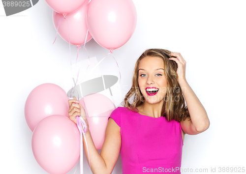 Image of happy young woman or teen girl in pink dress