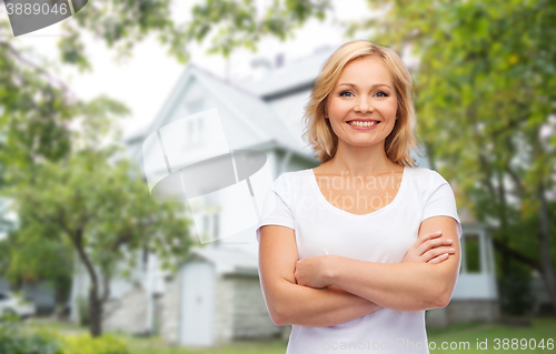 Image of smiling woman in blank white t-shirt