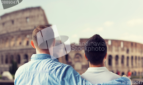 Image of close up of male gay couple over coliseum in rome