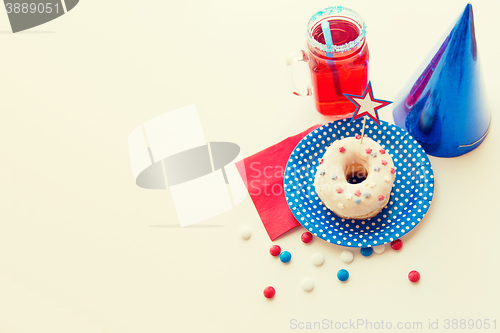 Image of donut with juice and candies on independence day