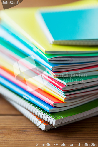 Image of close up of notebooks on wooden table