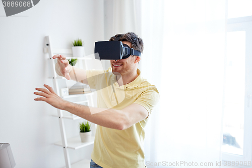 Image of young man in virtual reality headset or 3d glasses