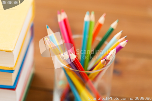 Image of close up of crayons or color pencils and books