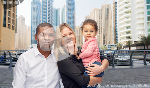 Image of multiracial family with little child in dubai