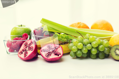 Image of close up of fresh fruits and berries on table