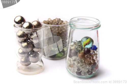 Image of small glass and metal spheres