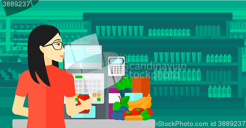 Image of Cashier at supermarket checkout.