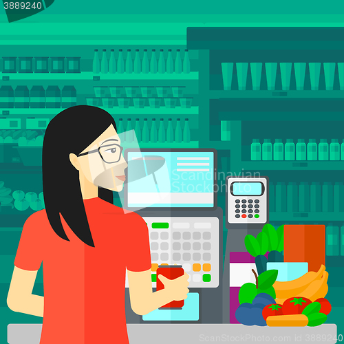 Image of Cashier at supermarket checkout.