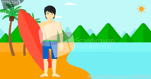 Image of Surfer holding surfboard.