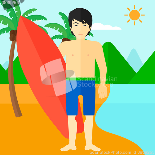 Image of Surfer holding surfboard.