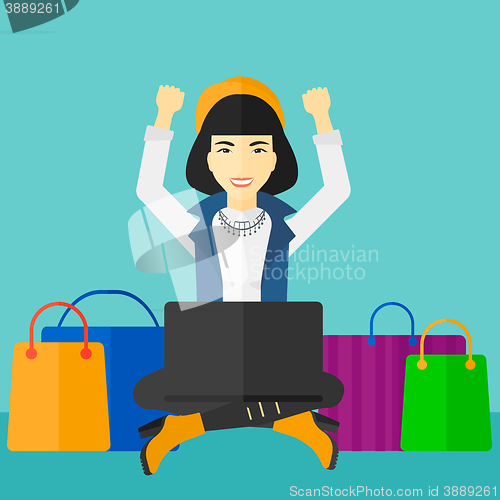 Image of Woman making purchases online.