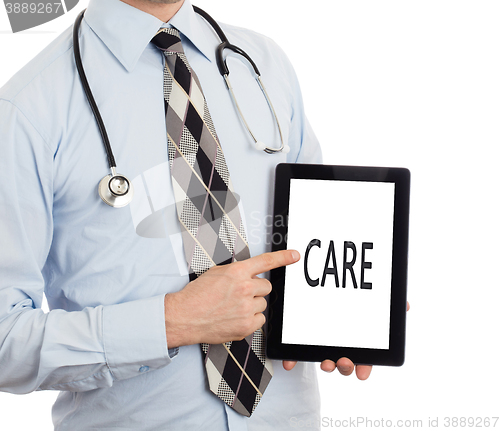 Image of Doctor holding tablet - Care