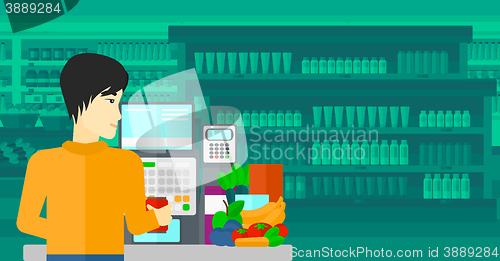 Image of Cashier at supermarket checkout.