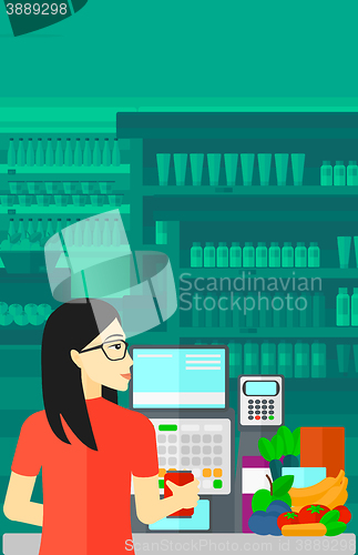 Image of Cashier at supermarket checkout.