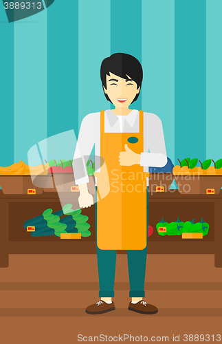 Image of Friendly supermarket worker.