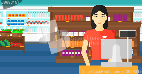 Image of Saleslady standing at checkout.