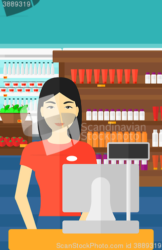 Image of Saleslady standing at checkout.