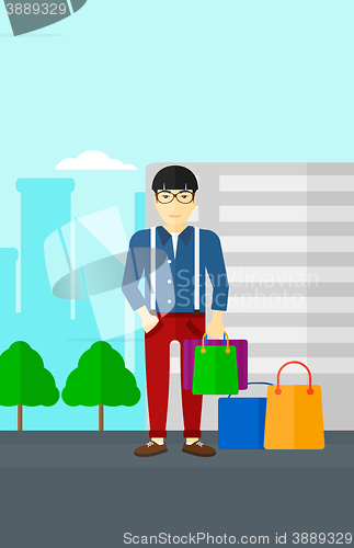 Image of Buyer with shopping bags.