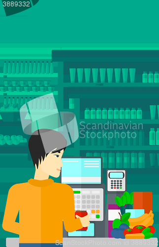 Image of Cashier at supermarket checkout.